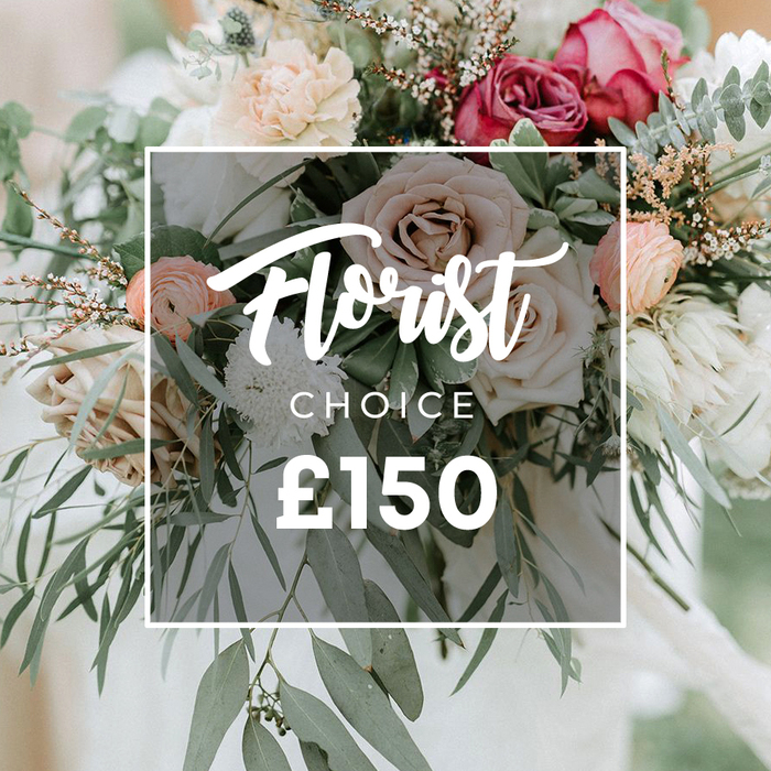 An abundant, artfully hand-tied bouquet fills the frame with soft drama and refined wildness - garden roses in pale cream and dusty peach blend into notes of mauve and rich fuchsia-burgundy, their open faces layered like velvet cups. Interlaced are delicate peach ranunculus, small white chrysanthemums with fine, thread-like petals, and clouds of tiny white filler flowers that catch the eye like light dust. Thin brown-red branching sprigs add a rustic, twiggy texture while sweeping stems of silvery-green eucalyptus and varied foliage create a cool, aromatic backdrop and a loose, organic silhouette. The arrangement balances formal beauty with a freshly gathered garden look, making it ideal for a wedding bouquet, anniversary surprise, or elevated gift. Centered on the image is a clean white rectangular frame: an elegant script spells Florist above the smaller uppercase CHOICE, and beneath those words the large white numerals display £150, indicating a premium, florist-selected offering. The setting beyond the flowers is softly out of focus - pale fabric or a bridal dress suggested in the light - emphasizing the bouquet's tactile qualities: velvet petals, papery ranunculus, the slight resinous scent of eucalyptus. Prepared with the same care we use at Flowers Golders Green, this design suits the tastes of the local Golders Green community, from Golders Hill Park gatherings to Hampstead celebrations, and is available for delivery across Golders Green and surrounding NW11 streets.