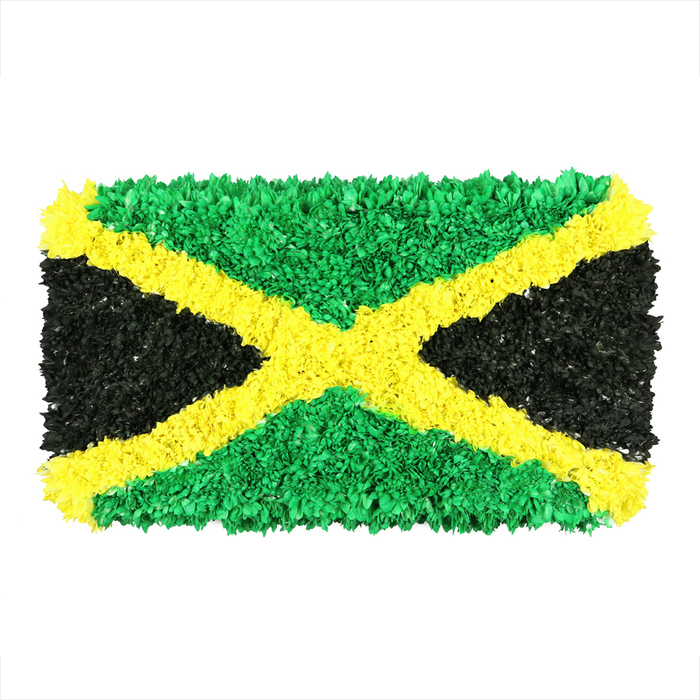 Imagine a Jamaican flag transformed into a tactile sculpture built from densely packed, tiny crinkled pieces of material-likely recycled scraps, tissue, or fabric-carefully arranged to form a living mosaic. A bright gold diagonal saltire travels from corner to corner, dividing the canvas into four bold triangles. The top and bottom triangles blaze with emerald green, their surfaces full of creases and ridges that catch the light; the left and right triangles present a deep, matte black, grounding the piece with a sense of quiet strength. The texture is unmistakable: hundreds of tiny, irregular facets create a three-dimensional surface that seems to shimmer and recede with every shift of the viewer's perspective. Set against a crisp white background, the colours feel vivid and immediate, like a handcrafted banner carried at a community event or art installation. This interpretation speaks to national pride, cultural identity, and the beauty of sustainable making, inviting conversations about Jamaica's heritage and contemporary art. In Golders Green, Hampstead Garden Suburb, and beyond, such artful tributes reflect a neighbourhood culture that values craft, storytelling, and connection; a piece like this would complement articles about Caribbean celebrations, or about local makers who transform everyday materials into meaningful symbols.