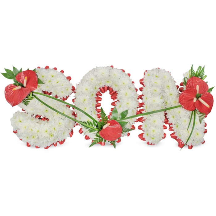 The image presents a refined funeral flower tribute spelling out the word SON in large, freestanding capital letters, positioned on a pure white background that isolates the design and highlights its detail. Each letter is fully covered with compact white chrysanthemums, their small rounded heads nestling together so tightly that no gaps are visible, creating a plush, almost quilted appearance. The white blooms form a serene, unbroken surface that suggests innocence, remembrance, and peace. Beneath this layer of flowers runs a deep red satin ribbon that emerges as a scalloped edging all around the outer contour of the letters. The ribbon is gently pleated, giving a rippled texture that contrasts with the softness of the petals and draws the eye along each curve. It also weaves into certain internal spaces, particularly inside the O, where it helps define the open circle and adds visual depth. Three carefully placed groupings of red anthuriums act as focal accents. On the upper left of the S, a cluster of glossy anthuriums, surrounded by dark green leaves and airy fern fronds, leans slightly outward as if bowing. At the lower right curve of the O, a single anthurium sits like a quiet punctuation mark. On the top right arm of the N, a fuller spray of several anthuriums and layered green foliage forms the final emphasis. Fine, arching green stems and leaves stretch across the letters, tracing gentle curves between each cluster and giving the tribute an organic flow. This bespoke memorial piece, such as a family around Golders Green Road might order through a trusted local florist, feels both contemporary and traditional, offering a heartfelt way to honour a beloved son with grace and love.