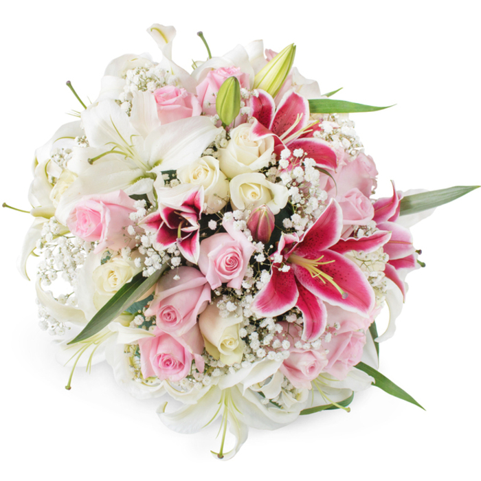 A beautifully rounded bouquet of lilies, roses, and baby's breath is carefully showcased against a seamless white background, the kind of refined arrangement you might see prepared early in the morning in a Golders Green studio before same-day delivery sets out. Dominating the composition are several pristine white lilies, their trumpet-shaped blooms wide open, revealing pale green centres and gently dusted stamens. Surrounding these elegant flowers, an abundance of roses in soft blush pink and creamy ivory shades cluster together, some tightly furled with the promise of opening, others already displaying their velvety, multi-layered petals. Injecting rich colour and drama, fuchsia and deep magenta Oriental lilies punctuate the design, their speckled petals curling slightly at the edges and creating a vivid contrast against the softer tones. Throughout the bouquet, countless tiny white blossoms of baby's breath form a whisper-light network, filling the spaces between the larger flowers and giving the whole arrangement an airy, cloud-like softness. Occasional flashes of fresh green foliage and slender lily leaves peek out from beneath the blooms, adding a natural rhythm and helping to define the bouquet's full, domed shape. The light is crisp and even, enhancing the fresh, dewy appearance of each petal and making every hue appear true and vibrant. The mood is one of elegant celebration and tender emotion, well suited to weddings, anniversaries, or heartfelt congratulations for families living near Golders Green station, Temple Fortune, or along Finchley Road. It feels like a bouquet chosen to mark a meaningful moment with grace and generosity.
