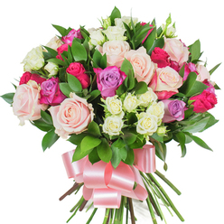 A dense, vibrant bouquet of mixed roses is presented on a pure white field, each bloom carefully chosen and placed to create an impression of abundance and soft elegance. Large roses in blush pastel pink and creamy ivory open out in full, their velvety folds layered like small gardens, while brighter fuchsia blooms and a few pale lavender roses add lively pops of colour and depth. Interwoven among these are clusters of petite spray roses, primarily cream with gentle yellow hints, whose smaller forms create texture and a sense of depth that invites closer attention. Glossy, dark green leaves-likely ruscus or salal-peek and fan between the blossoms, their smooth surfaces catching light and framing the colors with fresh contrast. The stems are gathered tightly at the base, finished with a generous baby-pink satin ribbon tied into a soft, reflective bow that drapes gracefully beneath the blooms. In my mind as a florist, I picture arranging this in the cool morning light that falls over Golders Green Road and the nearby streets off Finchley Road: a bouquet that smells faintly of roses and fresh cut greenery, radiating a mood of celebration and heartfelt warmth. It reads as an ideal gesture for Valentine's Day, Mother's Day, an intimate anniversary, or a special birthday - a floral message that feels both luxurious and approachable for recipients across Golders Green and the surrounding neighbourhoods.
