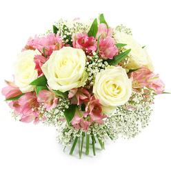 A lush, rounded bouquet of fresh white and pink blooms is shown against a seamless white background, the kind of hand-tied arrangement you might see being wrapped in brown paper in a Golders Green flower shop. At its heart, several generous white roses open in soft spirals, their creamy petals forming layered cups that invite you to imagine their velvety texture and subtle, green-stemmed fragrance. Threaded among them are multiple stems of pink alstroemeria, each bearing clusters of smaller, trumpet-shaped flowers. Their petals shift from soft pastel pink at the edges to a richer fuchsia and magenta near the center, finished with fine stripes and freckles that give each bloom its own personality. Between the larger flowers, mist-like clouds of white baby's breath create a gentle haze, filling any gaps and giving the whole design a light, almost floating quality. Fresh green leaves curve around the base of the blooms, adding depth and framing the colour palette in natural tones, reminiscent of a walk through nearby Golders Hill Park. The stems are carefully aligned and tied together, subtly visible at the bottom, indicating a classic, hand-crafted bouquet ready for a vase in a Golders Green living room or a café just off Finchley Road. The overall mood is romantic yet versatile, ideal for celebrations, thoughtful get-well wishes at a local clinic, or a quiet gesture of appreciation delivered to homes and offices across NW11.