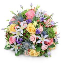 Viewed close, this domed bouquet feels like a small cultivated garden held in the hand: densely formed yet artfully airy where it needs to be. Soft garden roses in pale pink, buttery yellow, and warm peach are the primary note, their velvety spirals and gently scalloped edges offering a romantic, tactile warmth. Interleaved among them are pale-lilac and white clematis, their five-pointed faces and sunny centres lifting the arrangement with an almost ethereal grace. The arrangement's signature contrast arrives in the form of blue Eryngium - spiky, steel-tinged sea holly that reads like miniature sculptures and gives the composition a contemporary lift. Ruffled lisianthus in rich purple nestle between the larger blooms, and bright red Hypericum berries appear like small ornaments, scattering flashes of colour that catch the eye. A varied selection of foliage - glossy broad leaves for structure, fine feathery greens for softness, and occasional dark burgundy sprigs for depth - knits the elements together and creates the full, rounded silhouette. Gentle studio light from above picks out the petals' subtle gradients and the berries' slight sheen, suggesting freshness and fullness. The overall scent can be imagined as a delicate, floral sweetness with a green, almost herbal undernote. Perfect for birthdays, anniversaries, or as a thank-you that feels intimate and considered, this bouquet suits a recipient who appreciates both classic roses and a modern, textural twist. As a local touch, it evokes walks through Golders Hill Park and the quiet charm of Golders Green streets, where seasonal blooms and neighbourhood floristry inform a restrained, elegant aesthetic.