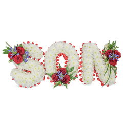 Beautifully hand-crafted and solemn, this floral tribute spells the nameable word SON in bold, three-dimensional capital letters set against a pristine white backdrop. Each letter is formed from a dense carpet of small white chrysanthemums; their rounded, powdery blooms overlap to produce a soft, tactile surface that suggests peace and purity. The perimeter of each character is neatly outlined with a vivid red satin ribbon, pleated into a scalloped border that crisply defines the shapes while adding a touch of formal elegance. Accenting the white framework are three carefully placed floral sprays: one perched on the top-left curve of the S, one nestled into the bottom-centre of the O, and one affixed to the top-right of the N. Every spray features deep red roses with velvety petals, upright blue-purple spikes of Liatris or a similar flower, and lush dark green foliage - including fern-like fronds and trailing leaves - which give depth, contrast and a gentle cascading movement. This arrangement carries the quiet language of condolence - white for serenity, red for enduring love - and sits equally well in a church, at a graveside or in the chapels around Golders Green. Prepared with attentive skill by local florists, Flowers Golders Green would arrange and deliver a tribute like this with the same care we show in our neighbourhood bookings near Golders Green Station and Hampstead Garden Suburb, mindful of scent, texture and the respectful mood it conveys.