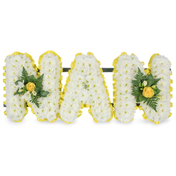 Gracefully composed by a local hand, this floral tribute spells out MAM in three generous capital letters, each letter densely covered in small white chrysanthemum sprays that create a soft, textured surface like a pale, comforting blanket. The perimeter of every letter is neatly banded with a bright yellow satin-like ribbon, its pleats catching soft daylight and lending a sunny outline that lifts the composition. At each end, the first and last M carry a delicate accent cluster centred on a tightly furled yellow rose bud, its honeyed fragrance suggested alongside tiny white freesia blooms or similar buds that bring a clean, floral brightness. Interspersed are deep green glossy leaves and feathery fern fronds, the cool foliage anchoring the arrangement and giving a gentle contrast to the warm yellow and pure white. A slender dark green or black horizontal bar sits unobtrusively behind the letters near their tops, holding them together as a stable, freestanding display suitable for laying at a graveside, standing at a chapel or placing beside a treasured photograph. The image is set against a pristine white background with soft, even lighting that emphasises texture and shadow, so every petal and ribbon fold reads clearly. Crafted with the quiet care we bring at Flowers Golders Green near Golders Green Road and the crematorium, this piece radiates respectful affection-white for purity and remembrance, yellow for memory and warmth-offering a calm, tender expression of love for a mother or maternal figure in times of farewell.