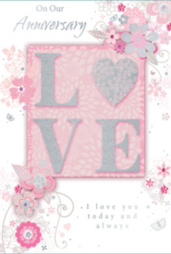 This anniversary card is designed like a softly glowing keepsake, with a refined palette of pearly whites, muted greys, and powdery blush pinks that recall the gentle tones of a romantic bouquet chosen in Golders Green. At its heart, the word "LOVE" is spelled out in textured, raised letters, each stroke edged with a fine dusting of glitter that catches the light with every slight movement. The letters sit against a blush-pink panel that seems to radiate a quiet warmth, as if illuminated by late-afternoon sunlight filtering through a window. Surrounding this central word, a delicate spray of illustrated blossoms and swirling vines sweeps across the surface, flowing in graceful arcs that mimic the natural line of stems and tendrils in a florist's design. The flowers are soft and stylised, drawn in whisper-light lines with subtle shading and touches of silver foil, giving the impression of petals lightly frosted with dew. Gentle curves and looping flourishes create a sense of lightness and celebration, as though confetti made of petals were drifting through the air. The overall texture of the card invites touch, from the raised glitter of "LOVE" to the smooth, almost satin-like finish of the background. An elegant anniversary message, scripted in a slender, flowing font, completes the composition, speaking of shared memories, enduring affection, and the promise of many more years together. It feels like something carefully chosen from a trusted local florist near Golders Hill Park, perfectly suited for same-day delivery when you want to mark your anniversary with both refinement and heartfelt emotion.