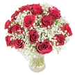 A classic, domed bouquet of approximately 18-20 rich, deep red roses, each bloom unfurled into velvety spirals, nestled amid generous sprays of fragile white baby's breath (Gypsophila paniculata). The roses sit in a clear glass vase; through the transparent water the long, verdant stems are visible, their straight green lines adding a quiet structure beneath the cloud-like gypsophila. Sunlight - as if filtered through the early morning air of Golders Green - glances along the crimson petals, revealing subtle variations from ruby to garnet and a soft sheen that suggests fresh dew. The baby's breath forms an airy halo around every head of rose, its tiny, snow-like blossoms cushioning the composition and softening the intense red with a whisper of innocence. Tactile contrasts are immediate: the lush, weighty velvet of the rose petals against the feather-light sprays of white, and the cool glass underhand that anchors the arrangement. The overall silhouette is rounded and compact, carefully shaped to feel full and intimate from every angle - a bouquet that reads as elegant and romantic yet approachable. The scent is quietly enveloping: classical rose perfume with a faint sweetness from the gypsophila, enough to invite a slow inhale without overwhelming. This is the sort of arrangement we place on anniversary tables, hand to a loved one on Valentine's Day, or deliver to brighten a special birthday; in Golders Green it feels at home beside a weekend coffee from a nearby deli or on a mantel after an evening stroll through Golders Hill Park. Crafted with deliberate balance and attention to freshness, the design speaks of heartfelt sentiment rendered simple and true.