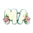 A dignified white MA funeral letter tribute is displayed as if ready for delivery to a memorial service in or around Golders Green, its craftsmanship captured in clear, even light. The capital letters are bold yet gentle in appearance, built from a tight covering of pristine white chrysanthemums that form a thick, cushiony layer. Each tiny bloom contributes to an overall impression of softness, as though the letters were carved from pure, white cloud. Enclosing this sea of petals is a neatly ruched band of dark green ribbon, carefully applied along the perimeter of each letter. The green edging outlines every straight line and diagonal, giving the M and the A sharp definition while also adding a touch of natural richness, reminiscent of the leafy streets leading down to Golders Green station. At the base of the left side of the M and the right side of the A, coordinated floral sprays offer gentle contrast. These feature lilac roses, soft-pink roses, and clusters of pink spray roses, layered together so their tones blend from pastel blush to deeper mauve. Fine fern fronds extend from beneath the roses, adding a feathery lightness and echoing the greenery of local parks. The tribute is photographed against a seamless white background, allowing its thoughtful details and classic colour palette to stand out. It feels deeply personal and loving, the kind of custom arrangement a family might choose to commemorate a cherished mum or mama, bringing a message of respect and remembrance to a funeral or cremation service nearby.