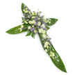 A solemn floral cross, photographed from a slight overhead angle on a clean white background, formed from broad, glossy tropical leaves that create the defined horizontal and vertical arms of the Christian symbol. The leaves - think deep, verdant Ti leaves with visible veins and a smooth, almost waxy sheen - are layered to give the cross a lush, structural base. Concentrated at the central intersection and spilling gently along each arm is a dense, tender cluster of blooms in a serene palette: ruffled ivory-and-cream lisianthus with soft, multi-layered petals and closed buds; small, bright white daisy-like chrysanthemums or miniature spray roses that add a peppering of round, luminous points; and fine sprays of pale lavender aster- or limonium-like flowers that bring a whisper of purple and delicate, star-shaped texture. Interspersed among the blossoms are slender sprigs of finer green filler foliage that soften edges and lend depth. The lighting is even and soft, revealing the velvety whites and the gentle contrast between the glossy greens and the airy pastel florals; the scent would read as quietly green with a faint, floral sweetness rather than overpowering. Crafted as a traditional sympathy tribute, this cross conveys calm, reverence and hope - suitable for placement at a funeral, memorial chapel or graveside. As a local florist familiar with Golders Green and the nearby Golders Green Crematorium and Hoop Lane chapels, we often prepare designs like this for services around Finchley Road, Temple Fortune and Hampstead Garden Suburb, taking care that the flowers arrive fresh, respectfully arranged and ready for condolence settings.