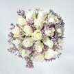 There is an effortless grace woven through this bouquet, echoing the early morning calm of Golders Green. Plush white roses, each petal unfolding in creamy spirals, form the generous heart of the design-hinting at hope and new beginnings. Between them, lacy sprays of pale lavender statice bring a touch of gentle colour and textural intrigue, much like the dappled blooms found on strolls through Golders Hill Park after rain. Set against a luminous white backdrop and bathed in soft, natural light, the purity of every bloom is heightened-each velvet-soft petal inviting contemplation and comfort. This arrangement speaks of serenity and quiet celebration, intended to offer solace, congratulation, or heartfelt support. As the gentle fragrance diffuses, the artistry of Flowers Golders Green is evident in every stem-a bouquet crafted to linger in memory, carrying a sense of peaceful optimism that mirrors the welcoming spirit of its local neighbourhood.