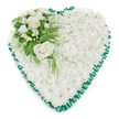 A luminous heart-shaped funeral tribute is presented on a crisp white background, allowing its gentle beauty to be seen in full. The central surface of the heart is completely covered with compact white chrysanthemums, their tidy, tightly packed blooms creating a soft, cloud-like cushion of petals. This smooth, snowy blanket of flowers suggests peace, purity, and stillness, echoing the soothing calm of a quiet walk through Golders Hill Park on a clear day. The chrysanthemums are arranged so evenly that the heart appears almost sculpted from flowers, with no visible gaps or stems.
Around the entire edge, a rich emerald green satin ribbon is carefully pleated to form a ruffled border. Its glossy texture and deep colour sharply define the heart's outline and offer a dignified contrast to the matte whiteness of the blooms. In the upper left curve, an elegant accent spray brings focus and emotion. Here, two white roses in full bloom open gracefully, their layered petals curling outward in soft spirals that speak of enduring love and honour. Nestled around them are smaller, airy white flowers, reminiscent of freesias or other fine blossoms, which add lightness and a sense of gentle movement.
Lush greenery frames the cluster, with broad, shiny leaves and wisps of feathery foliage that stretch delicately across the chrysanthemum base. These green accents give depth and a natural, garden-like quality to the design, as though a fresh breeze had just passed through. The overall impression is one of quiet respect and heartfelt condolence-a floral heart that could be placed at a funeral service or graveside near Golders Green, offering comfort and a final message of love in a beautifully composed tribute.