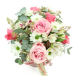 A graceful hatbox bouquet sits centred against a bright white background, its soft colours and rounded shape creating a feeling of calm, romantic abundance. The container is a pale blush pink hatbox, smooth and elegant, banded with a narrow ribbon in a richer pink tone and finished with a small cream tag, as if it has just been prepared in a Golders Green flower shop and is ready to be hand-delivered. Rising in a lush dome, light pink roses command attention; their petals curl in perfect spirals, velvety and layered, some blooms fully open, others just beginning to expand, giving the piece a sense of gentle movement. Nestled closely among them are white daisy-like chrysanthemums, each with a bright green centre that brings a lively sparkle to the otherwise soft palette. White alstroemeria flowers weave delicately through the arrangement, their slender petals brushed with fine purplish-red streaks and dots, adding subtle drama and intricate detail. The greenery is both varied and deliberate: rounded eucalyptus leaves in a cool, silvery-green drift through the bouquet, contrasting with darker, strappier foliage that supports the flowers and adds depth. Small, reddish-brown buds or berry-like clusters peek out from between the petals, linking the colours of the ribbon and blooms and enhancing the natural, garden-picked charm. The entire composition feels considered yet effortless, like a bouquet chosen for a birthday brunch near Golders Hill Park, a sweet anniversary surprise in a flat off Golders Green Road, or a soothing gesture of gratitude delivered the same day to someone in NW11 who could use a moment of beauty and reassurance.