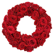 An elegant, solemn wreath of crimson roses, densely packed against a neutral white background, fills the frame with quiet authority. The ring is built entirely from dozens of fresh, deep red roses, with stems trimmed away so the blossoms create a seamless circle of velvet and fire. Each bloom appears fully opened, its petals unfurled in soft spirals that flow into a continuous surface, while the hollow center remains clearly defined, inviting the eye to pause and reflect. The uniform ruby-red tone and the plush texture convey both celebration and memory, a duality that makes this image ideal for articles about remembrance, funeral tributes, anniversaries, or condolences. The craftsmanship is evident in every petal, every careful placement, and every subtle variation in bloom size that keeps the ring lively rather than flat. Against the pale background, the wreath glows with a sense of ceremony and grace, a statement of taste and reverence. 

Locally, this design resonates with the Golders Green community-an everyday emblem in church foyers, homes, and community spaces during rites of passage or tribute moments. Florists here, including Flowers Golders Green, bring the same devotion to detail: arriving to the scene with blooms prepared at dawn, ensuring delivery to Golders Green, Hendon, Finchley, and nearby streets in perfect condition and on schedule. This image is a powerful reminder of how red roses can express condolence, love, and enduring connection, while still remaining a work of art in its own right. 

In the neighbourhood, it speaks to families and friends who seek beauty that honours memory with grace and restraint.