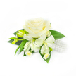 A poised wedding corsage captured against a pristine white backdrop, where a single creamy white rose sits at the heart of a delicate composition. The rose's many velvety petals curl inward at the center and open outward in layered waves, catching soft highlights and subtle shadows that suggest a cool, morning light. Surrounding it are slender, alstroemeria-like blooms in soft ivory, their slightly elongated petals tipped with faint texture, and two green, tapered buds to the left that promise new blooms. Beneath and between these larger forms, tiny white daisy-like flowers with pale yellow centres nestle closely, adding a playful, intimate texture like confetti tucked into foliage. A base of deep, glossy green leaves-broad and smooth-frames the whole piece, offering contrast and structure while letting the whites read as pure and luminous. On the right, a small cluster of lustrous white pearls is gently arranged among the blooms, catching the light and lending a classic bridal note that speaks of quiet refinement. The overall effect is soft, refined, and reassuring-a corsage that feels weightless and composed yet crafted with careful intent. Imagine this piece pinned at a wedding reception near Golders Hill Park or passed discreetly at Golders Green Station as a keepsake for the family; it reads as both celebratory and tender. The description focuses on texture, scent, and composition-the cool scent of rose petal, the delicate papery snap of alstroemeria, and the faint metallic glint of pearls-so someone who cannot see the photo can imagine its layered, gentle beauty.
