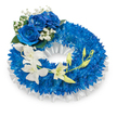 A serene, circular funeral wreath crafted in deep blues and pure whites, described for a client who cannot see it: the main body is a dense, voluminous ring of small, royal-blue chrysanthemum florets, each tiny petal contributing to a plush, almost velveteen texture that reads as a continuous carpet of colour. The wreath sits against a clean white backdrop in soft, diffused light, and a finely pleated white satin ribbon lines the inner opening and subtly shows beneath the flowers, its smooth sheen offering a gentle, structured contrast to the fuzzy chrysanthemum heads. At the upper-left arc, a cluster of three large blue roses anchors the composition-fully opened, their layered petals are a rich sapphire with a velvety surface that catches the light and adds sculptural depth. Fine sprays of airy white baby's breath and a few dark green leaves nestle around the roses, adding delicate punctuation and a sense of quiet refinement. From mid-left the eye follows a graceful cascade of ivory-white orchid blooms, likely Phalaenopsis, flowing down toward the lower-right; their satin-like petals and central throats bring an ethereal softness that balances the saturated blue. Scattered among the orchids are fresh green buds in various stages of opening, a subtle symbol of renewal and continuity. The overall scent is faintly floral and clean, the textures ranging from spiky to silky, meant to evoke calm, dignity, and heartfelt remembrance. As a local Golders Green wreath, it is thoughtfully composed for services around Golders Hill Park and the neighbourhood, offering a respectful tribute that reads as both elegant and consoling.