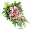 On a pure white background, a lush diagonal funeral spray stretches from the gathered stems at its upper left corner into a soft cascade of foliage and petals at the lower right, creating a sense of gentle movement and farewell. The arrangement is richly layered with flowers in pink, fuchsia, and white, dominated by large gerbera daisies whose open, circular faces in pale blush and deep magenta provide striking points of focus. Interwoven with them are elegant pink roses, their neatly spiralled petals unfolding in measured swirls, joined by clusters of white, cushiony blooms that resemble small carnations or chrysanthemums, adding a calm, cloud-like softness. Sprinkled throughout, delicate daisy-like filler flowers in bright white contribute a more informal, meadow-style touch, recalling the kind of simple blossoms you might see in the gardens around Golders Green's residential streets. Pockets of glossy red hypericum berries nestle among the petals, bringing a hint of warmth and subtle depth to the colour palette. The flowers sit within a generous frame of greenery: broad, polished dark green leaves serve as a sturdy backdrop, feathery bright green ferns break up the outlines with fine texture, and stems of silvery eucalyptus run through the spray, implying a cool, refreshing scent. From the lower right, slim palm leaves stream outwards, enhancing the elongated silhouette and guiding the eye along the spray's length. The neatly bound stems at the top left quietly showcase the craftsmanship behind the design, likely created in a nearby Golders Green flower shop for a funeral or memorial service. Overall, the tribute conveys a feeling of peace, remembrance, and love, making it a fitting floral farewell for a local chapel, crematorium, or family home visit.