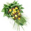 A long, teardrop-shaped funeral spray of yellow roses and red berries is arranged carefully on a stark white background, highlighting its graceful silhouette. The top left of the design shows where the stems are gathered and bound, forming the anchor point from which the flowers and foliage gently fan out. Along the central line of the spray, a generous grouping of yellow roses in various stages of bloom draws the eye. Some roses appear as neat, compact buds, while others open into full, layered rosettes, their petals a warm, glowing yellow that suggests friendship, gratitude, and tender remembrance. Between these blooms, small clusters of rounded red berries, likely Hypericum, are tucked in, their deep crimson tones and smooth, polished skins offering a striking contrast to the roses' soft texture. The surrounding greenery is abundant and thoughtfully arranged. Broad, dark green leaves provide a solid, lush base at the top and centre, some folded with precision to create depth and a slightly architectural feel. As the spray narrows toward the lower right, the foliage transitions into long, slender palm fronds that sweep outward, their delicate, pointed leaflets giving the piece an elegant, flowing movement. The crisp, even lighting showcases the satin finish of the leaves and the velvety surfaces of the rose petals without harsh shadows. This composition has a calm, respectful presence, the kind of tribute often delivered to services in and around Golders Green Crematorium or local synagogues, offering a balance of gentle colour and quiet dignity for families saying a final farewell.