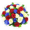 A striking dome of roses fills the composition, formed from a compact cluster of blooms in three commanding shades: velvety deep red, luminous white, and vivid cobalt blue. The bouquet is tightly built so that the flowers create a smooth, rounded silhouette, with each rose leaning gently into the next, leaving no empty spaces and giving the impression of a single, unified form. Every rose is open at its fullest, petals layered in graceful spirals that curl and soften at the edges, creating a textured surface that looks plush and inviting. The red roses lend a note of passion and gratitude, the white roses contribute purity and tranquillity, and the blue roses add a bold, contemporary twist that immediately calls to mind patriotic celebrations and meaningful ceremonies. Delicate glimpses of dark green foliage are visible between some of the blooms, the glossy leaves adding quiet contrast and helping to highlight the intensity of the primary colours. The bouquet is presented against a pure white background and lit with bright, even light, which sharpens each outline and enhances the rich saturation of the hues, while gentle shadows between the flowers suggest depth. No stems, vase, or surrounding details can be seen, making the colour and form of the roses the clear focal point. The overall mood is both festive and dignified, ideal for occasions where honour and remembrance are central-whether that's a national holiday, a memorial, or a significant family celebration in Golders Green. One can picture this arrangement on a dining table or sideboard, becoming the natural centre of attention and quietly expressing pride, unity, and heartfelt respect through its carefully chosen colours.